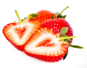 Heart shaped strawberries cut in half isolated